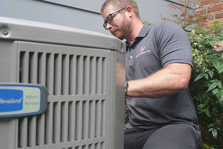 Eastergard technician servicing HVAC system Ask ChatGPT