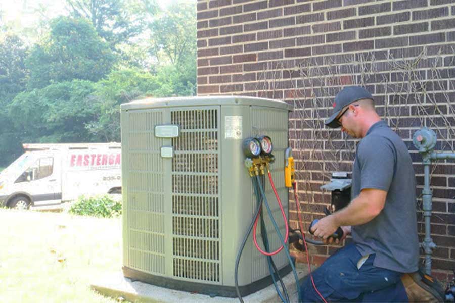 Eastergard tech checking HVAC pressure