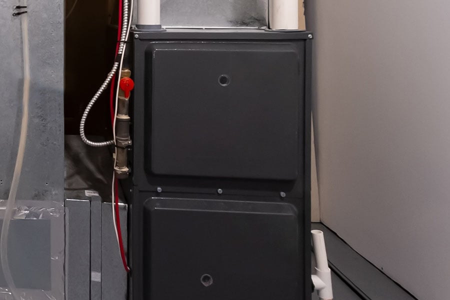 Basement heating system with black furnace unit