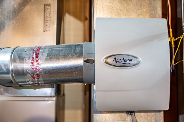 Whole house humidifier attached to HVAC heating duct