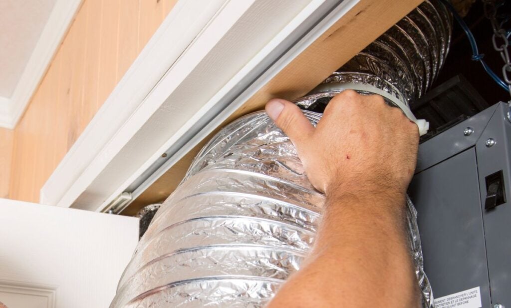 ventilation cleaner man at work with tool