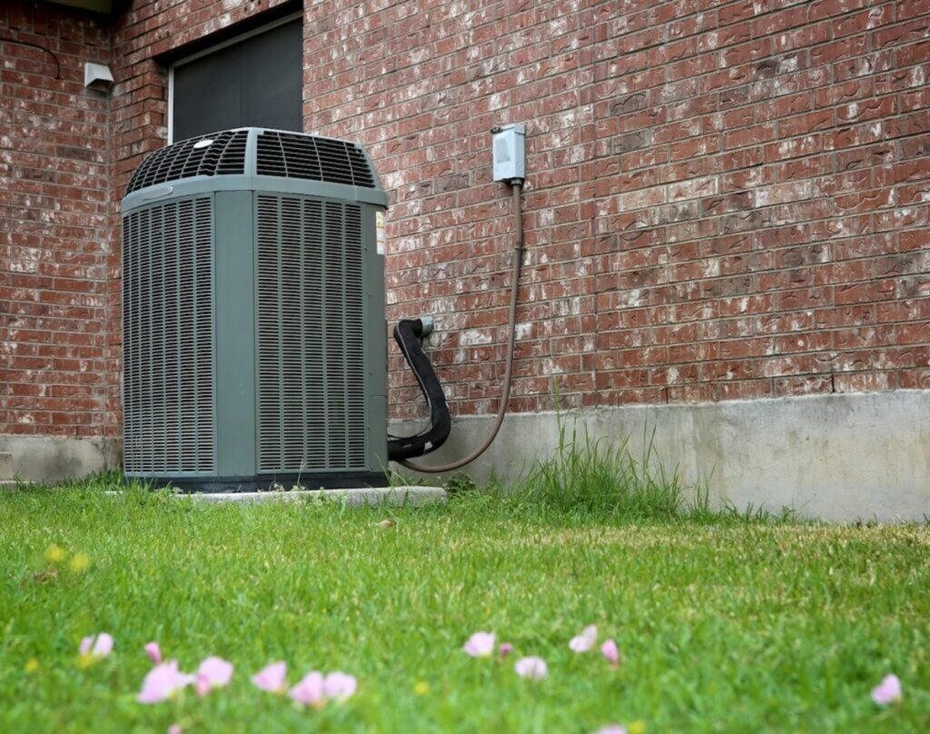 High efficiency modern AC-heater unit on brick wall background
