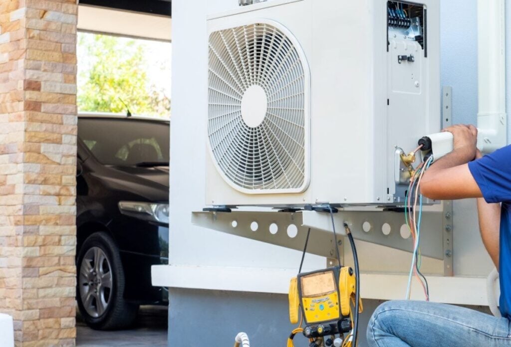 technician-replacing-AC-compressor