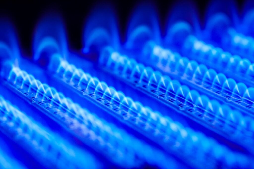 Propane flame inside of gas boiler furnace